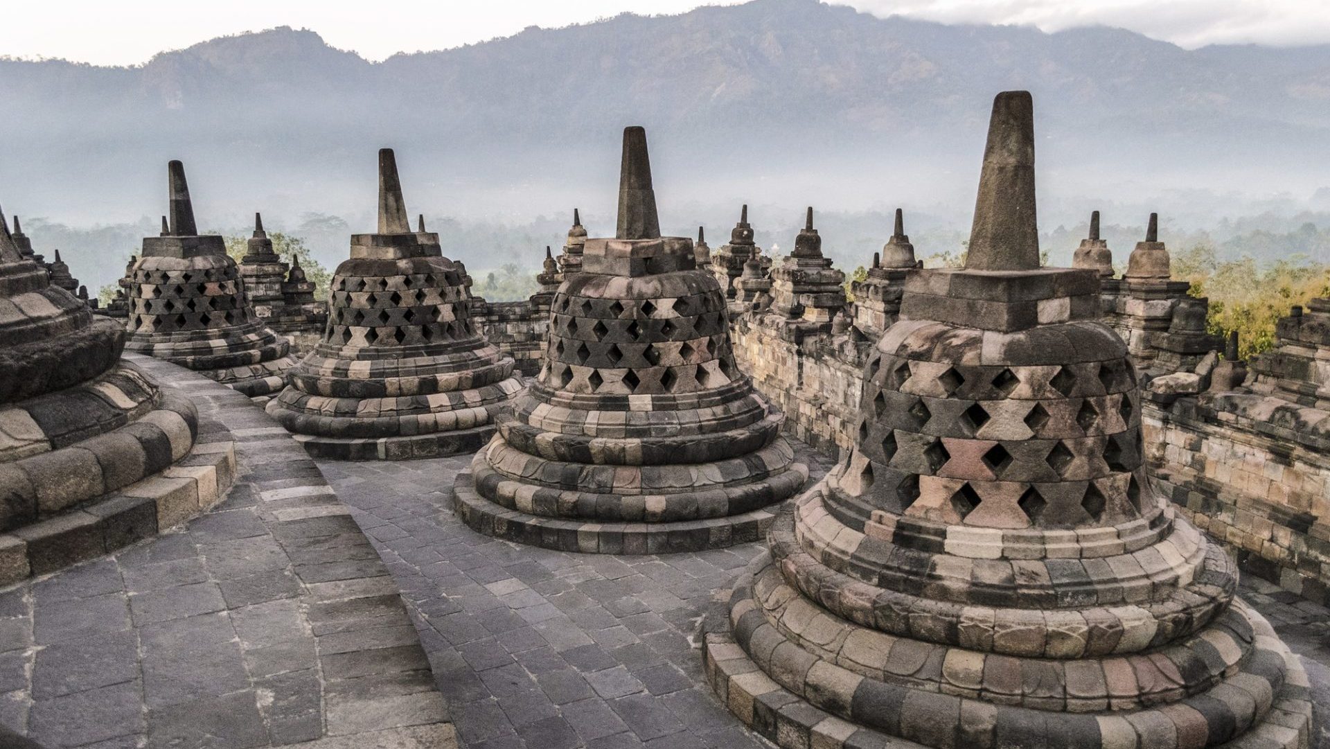 borobudur-temple-a-9th-century-buddhist-temple-with-terraces-and-stupa-with-latticed-exterior-bell-e1712123935560.jpg